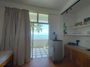 Absolute Beachfront Studio with Kitchen & Balcony